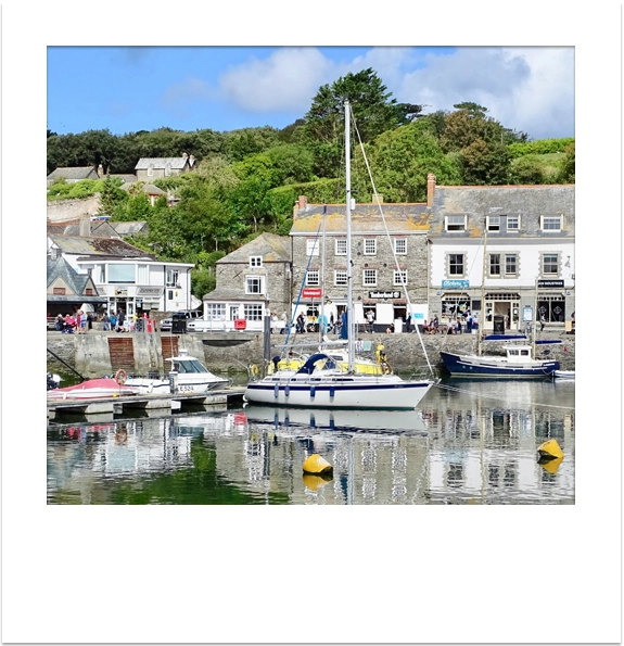 Sailing boat moored in the harbour at Padstow, North Cornwall.